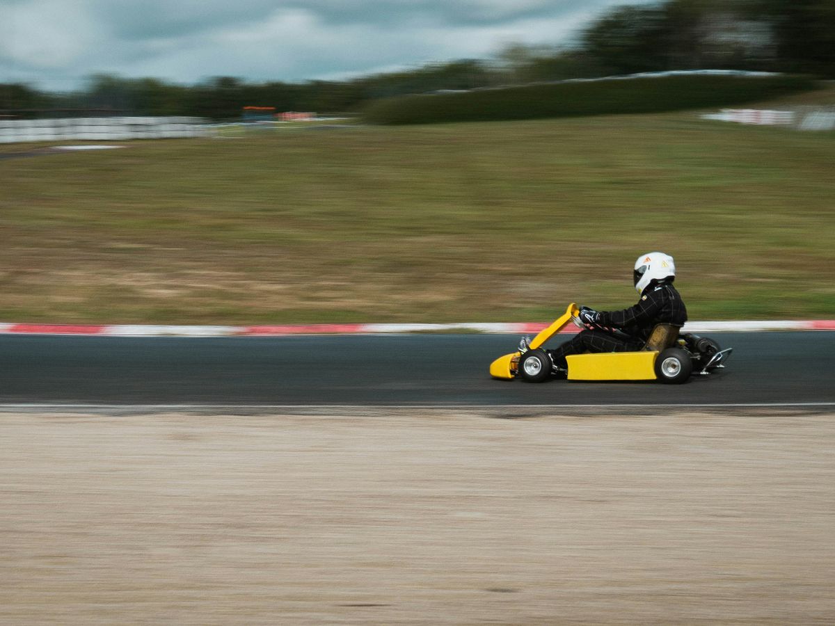 yellow and black go kart on track