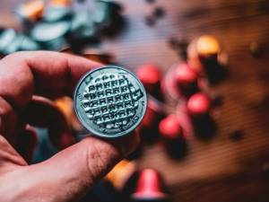 A person holding a coin in their hand