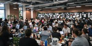 Diverse team collaborating in a vibrant marketing office setting.